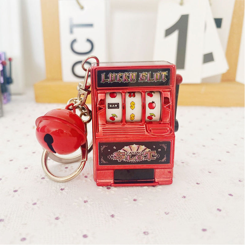 Key ring designed in the form of a slot machine