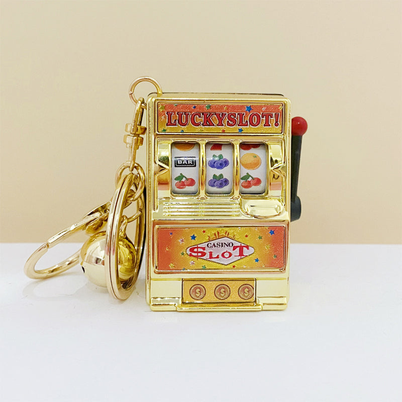 Key ring designed in the form of a slot machine