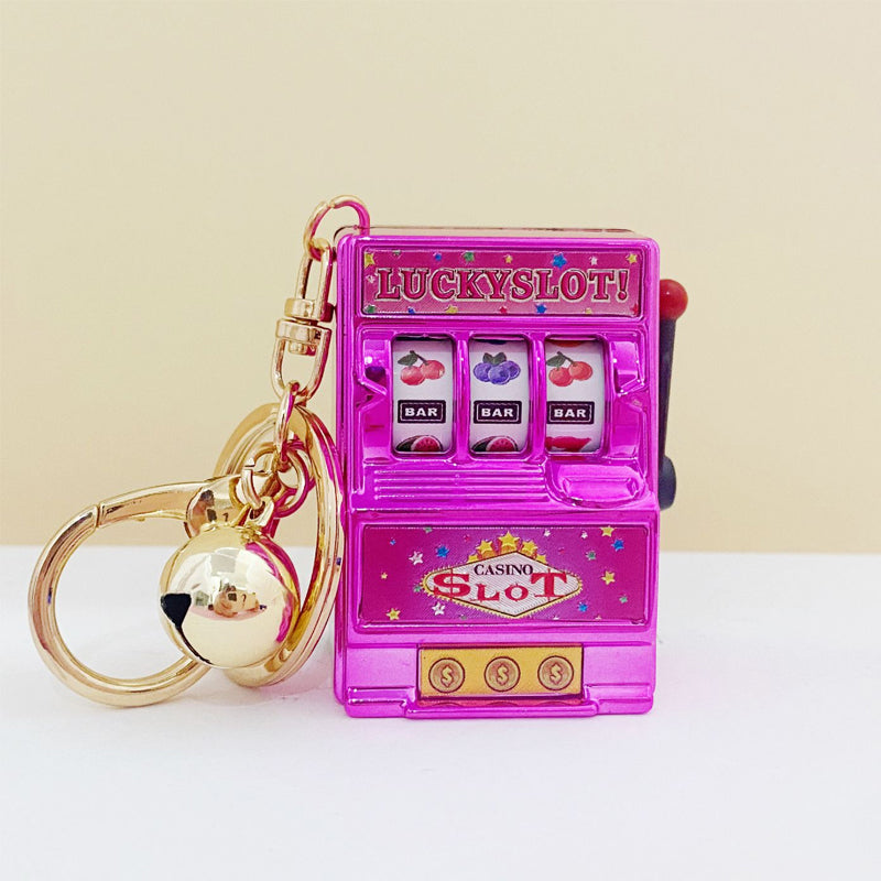 Key ring designed in the form of a slot machine