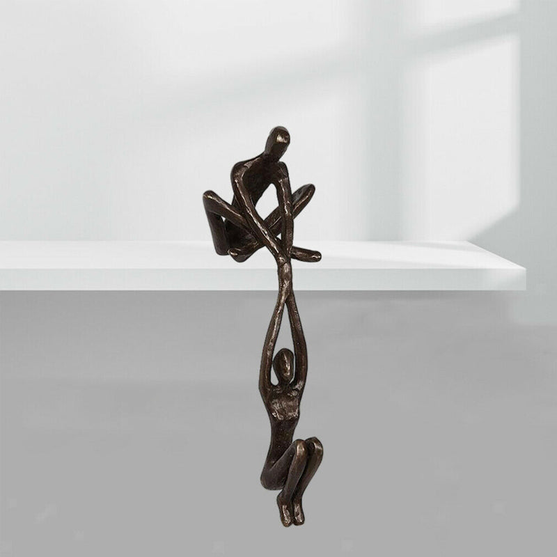 Bronze Sculpture - Man Lifting Woman from Ledge