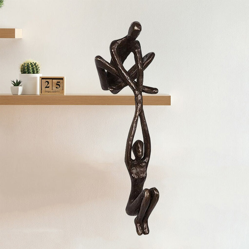 Bronze Sculpture - Man Lifting Woman from Ledge