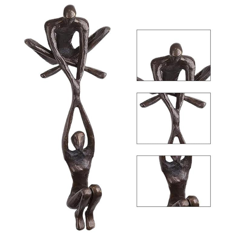 Bronze Sculpture - Man Lifting Woman from Ledge