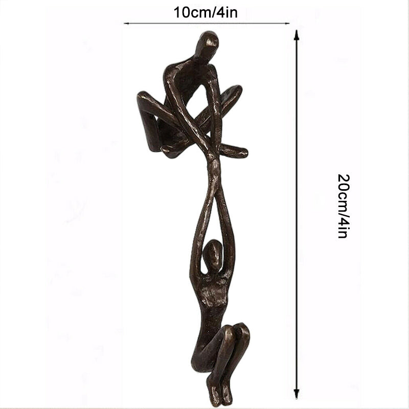 Bronze Sculpture - Man Lifting Woman from Ledge