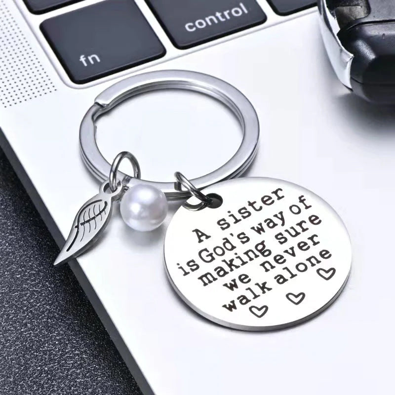 A Sister is God's Way of Making Sure We Never Walk Alone Keychain