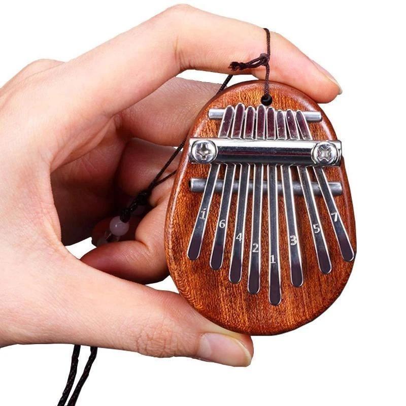 Mini thumb piano